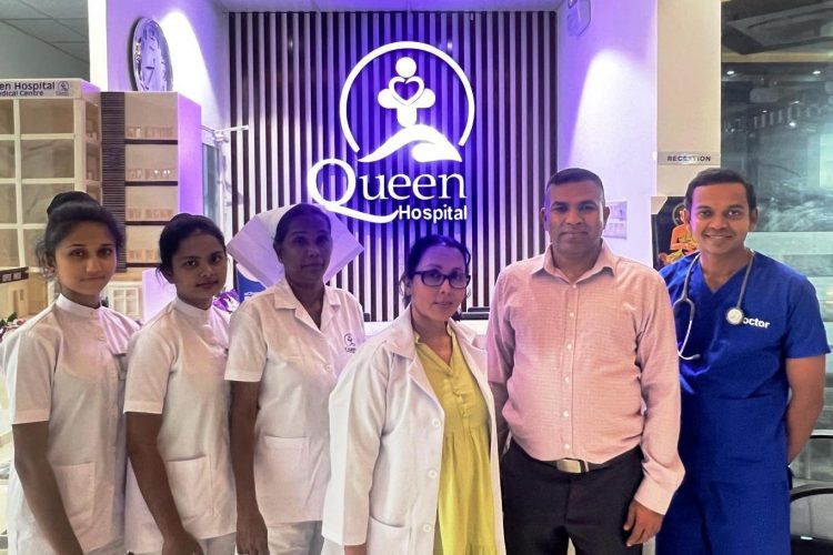 Queen Hospital team standing together at the medical centre in Ratmalana.